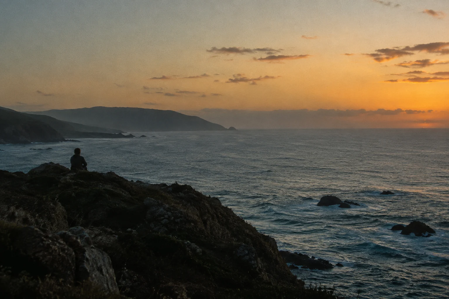 Generated visual placeholder: a solitary figure overlooking the Pacific coast at dusk.